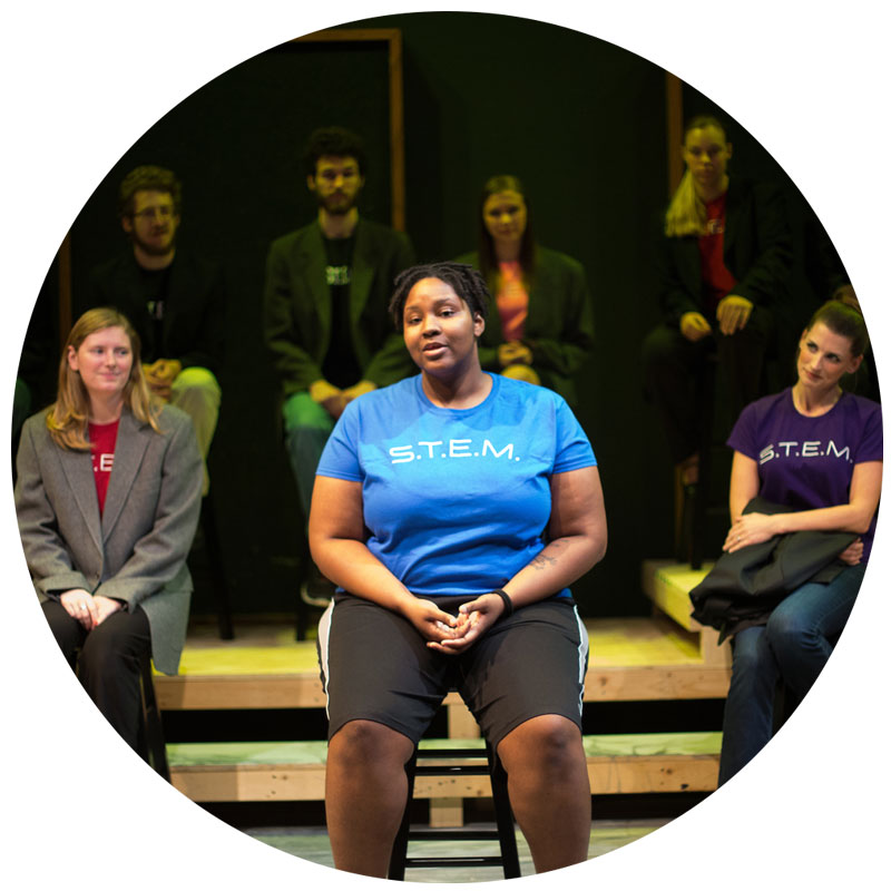 Students sitting on a stage